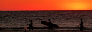 Surfers at Sunset