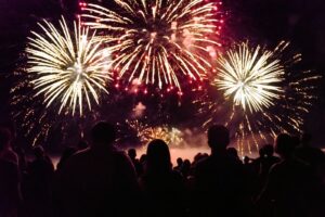 group of people watching a fireworks show in Oak Island